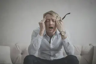 Man Touching Face