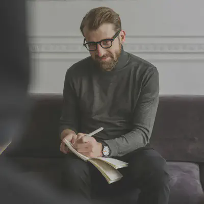Man Writing Notes