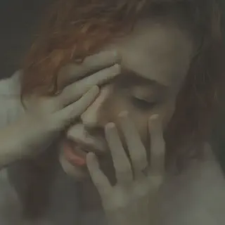 Woman Covering Face
